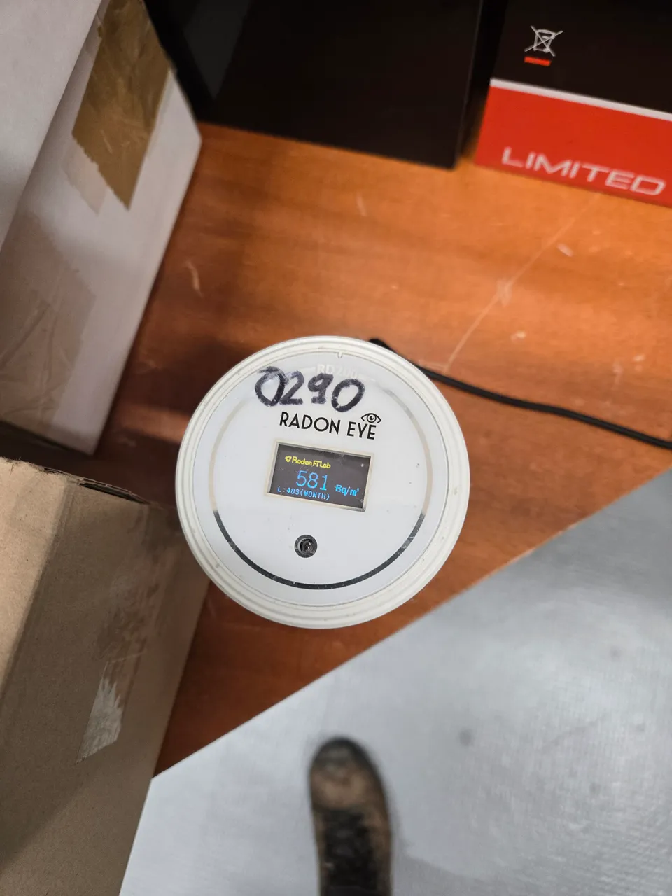 Radon measuring device installed in a building; the display reflects the moment the photo was taken.