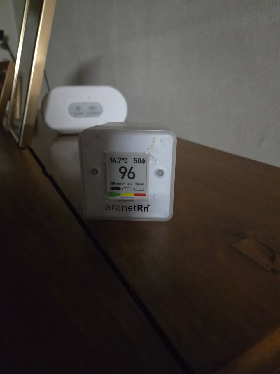 Radon measuring device installed in a building; the display reflects the moment the photo was taken.
