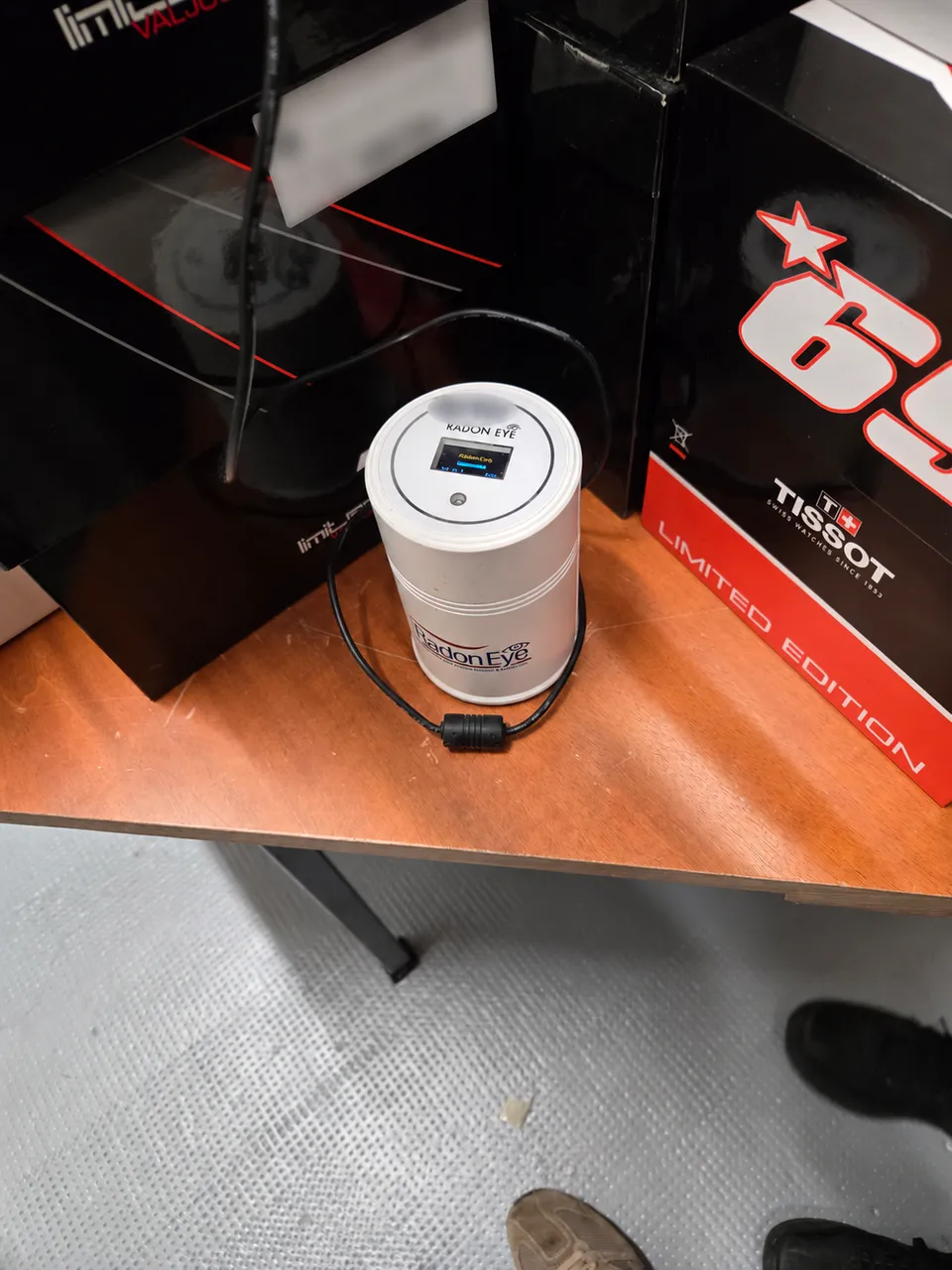 RadonEye device in place; label and inventory number blurred.